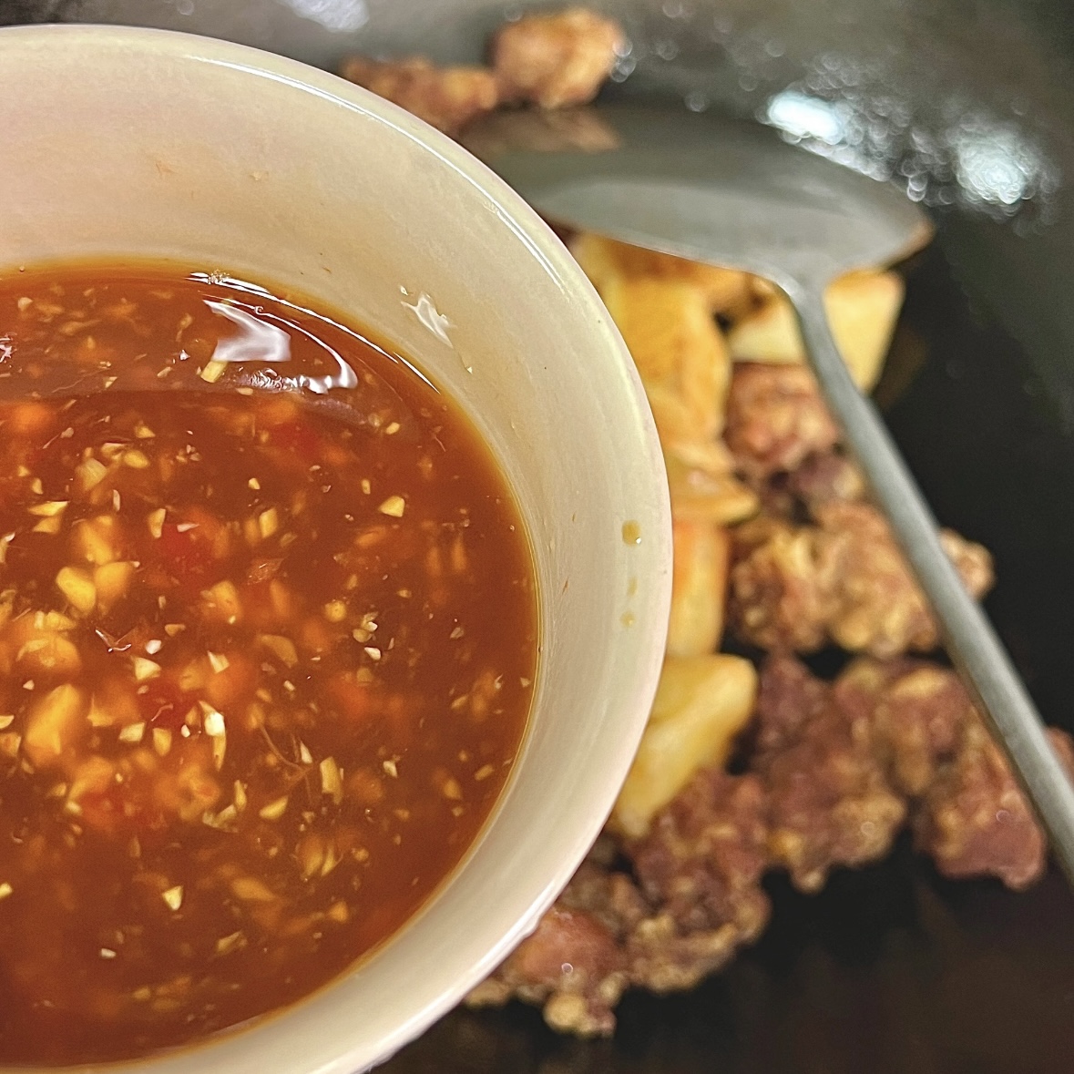 Simmering red sauce for lychee pork
